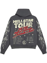 A dark gray hoodie shown from the back, featuring a large graphic print for 'Hellstar Tour' with white and red text, stars, and white flame-style designs on both sleeves.