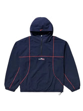 A navy blue hooded windbreaker jacket with red piping details and a white 'streetfly' logo on the chest, displayed against a solid light gray background.