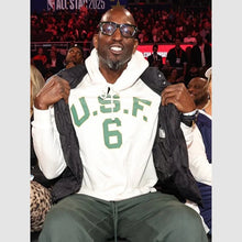 A man wearing a white U.S.