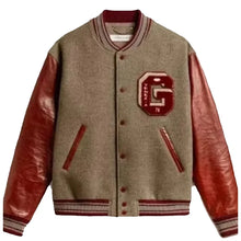 A varsity-style jacket with a taupe wool body, reddish-brown leather sleeves, and a red embroidered letter 'G' patch on the chest, shown against a light gray background.