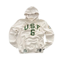 An off-white hooded sweatshirt with green 'U.S.